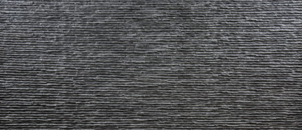 Coraggioso Caldo warm concrete wall panel featuring natural cement texture with earthy tones for flexible interior installation